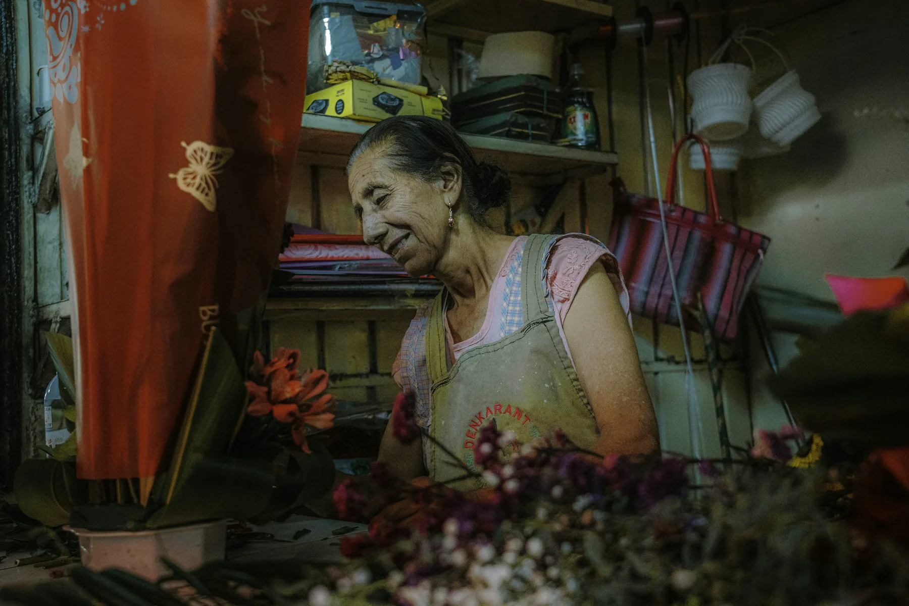 A flower shop owner working at her stall