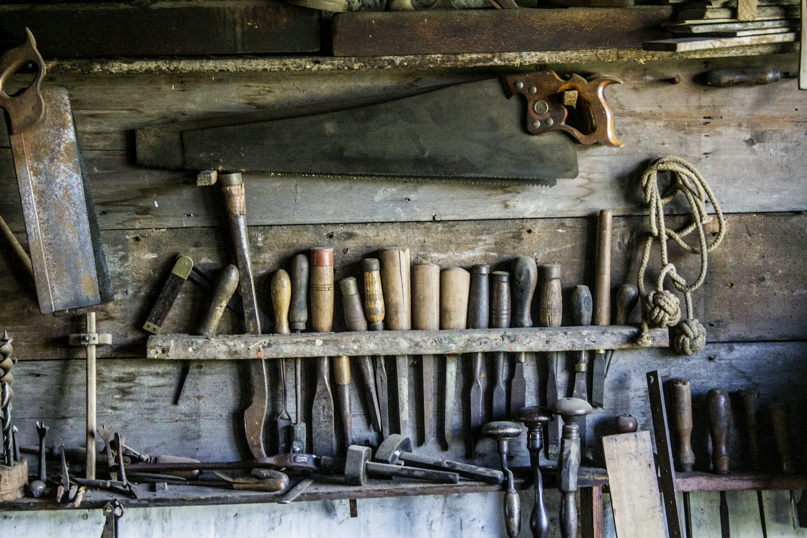 Carving tools arranged on a wooden rack